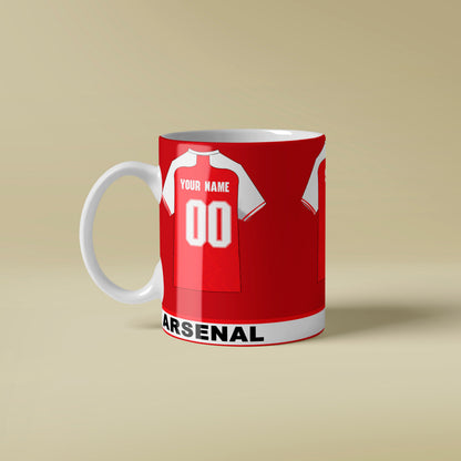 Red mug with Arsenal football club design on a beige background