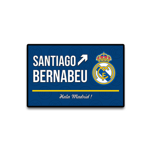 Santiago Bernabeu sign with Real Madrid logo on a blue background