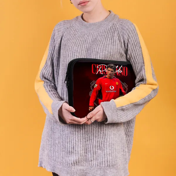 Person holding a tablet case with a sports player design on a yellow background