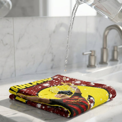Colorful towel on a marble countertop with water being poured over it.