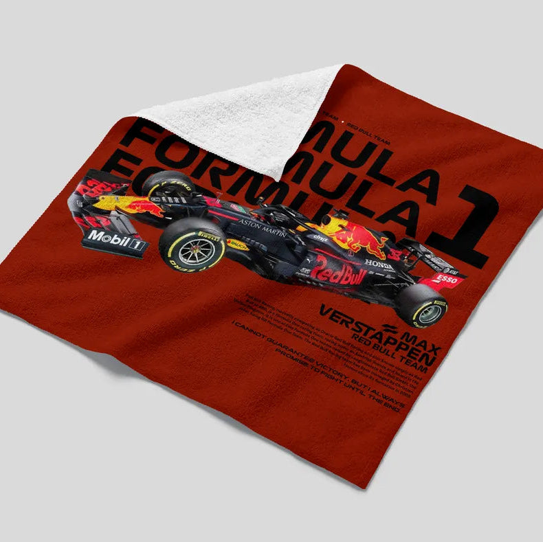 Red Formula 1-themed towel with a car design on a gray background
