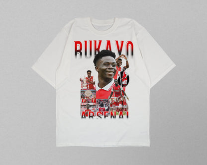 White t-shirt with a collage of images and text on a gray background