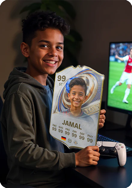 Child holding a 'Jamal' card with a soccer theme, smiling in front of a screen showing a soccer game.