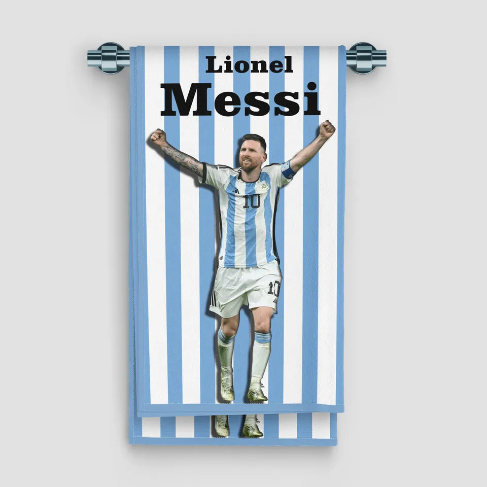 Towel with a graphic of a soccer player in a striped pattern, featuring the name 'Lionel Messi'.