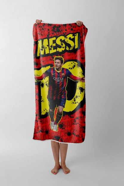 Person holding a towel with Messi's face and number 10 on a red background