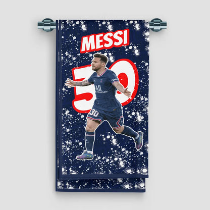 Towel with a soccer player in a blue uniform and 'Messi 30' text on a dark blue background.