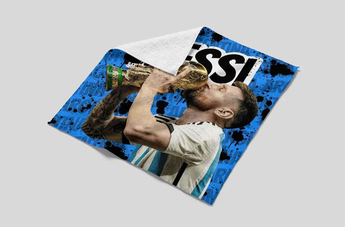 Towel with a sports player design and 'Messi' branding on a gray background