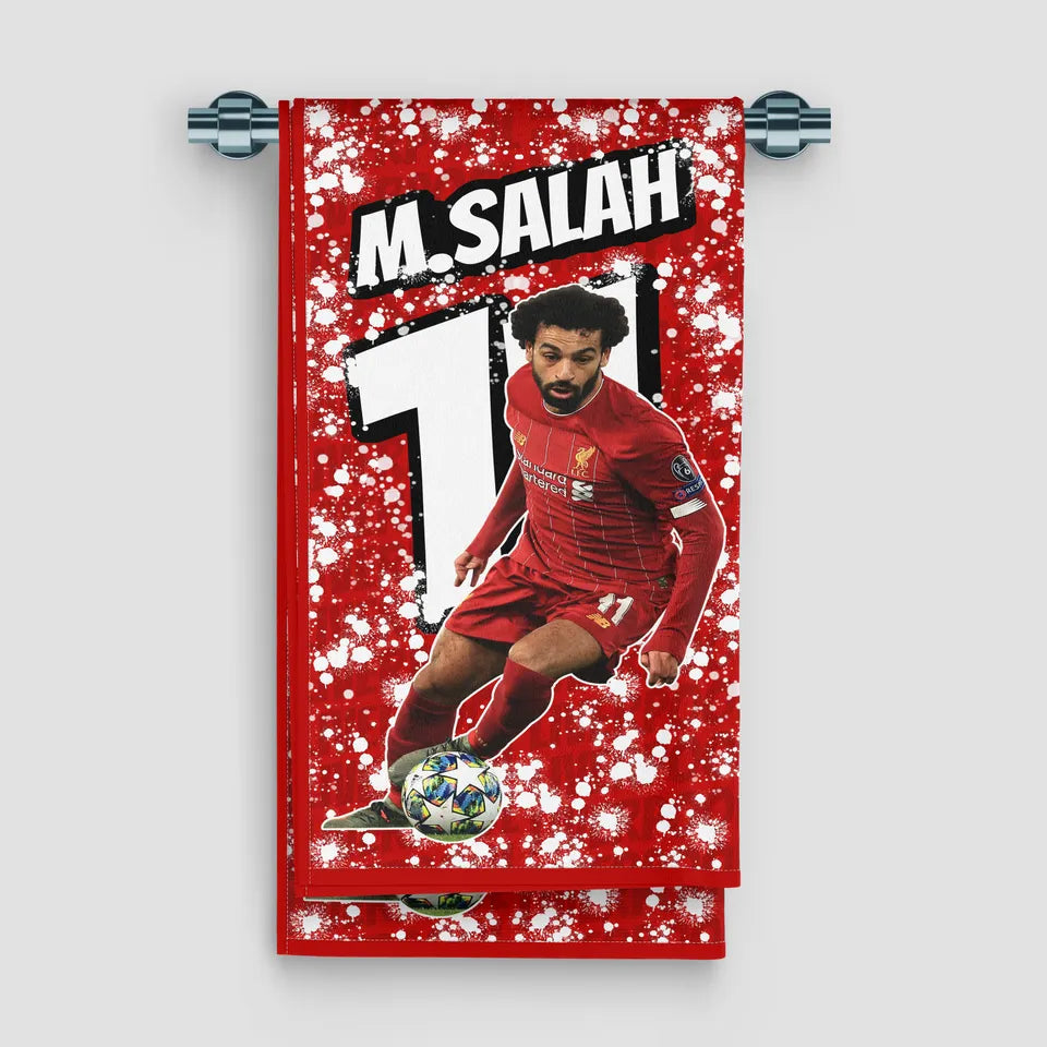 Towel with a soccer player in red jersey on a red background with snowflake pattern