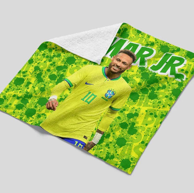 Blanket with a soccer player design and 'Mar Jr.' text on a gray background