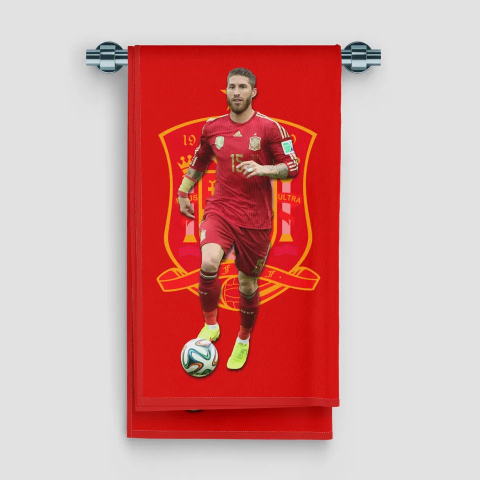 Red towel with soccer player and Spain national team logo on a white background