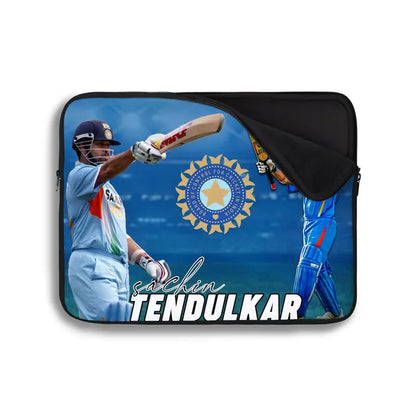 Laptop sleeve with a cricket player design and 'Sachin Tendulkar' text on a blue background.