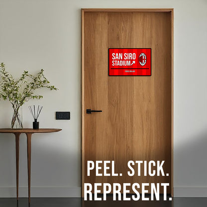 Wooden door with a red and white sign labeled 'San Siro Stadium' and text 'Peel. Stick. Represent.'.