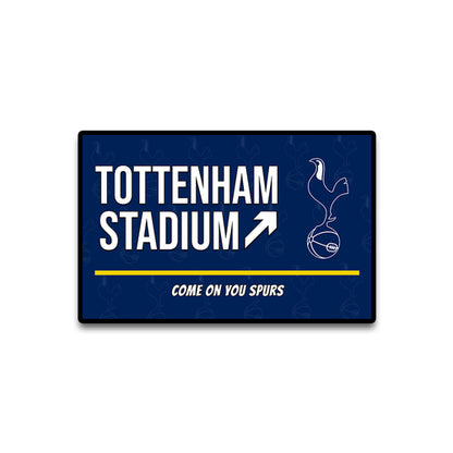 Navy blue sign with 'Tottenham Stadium' and Spurs logo on a white background